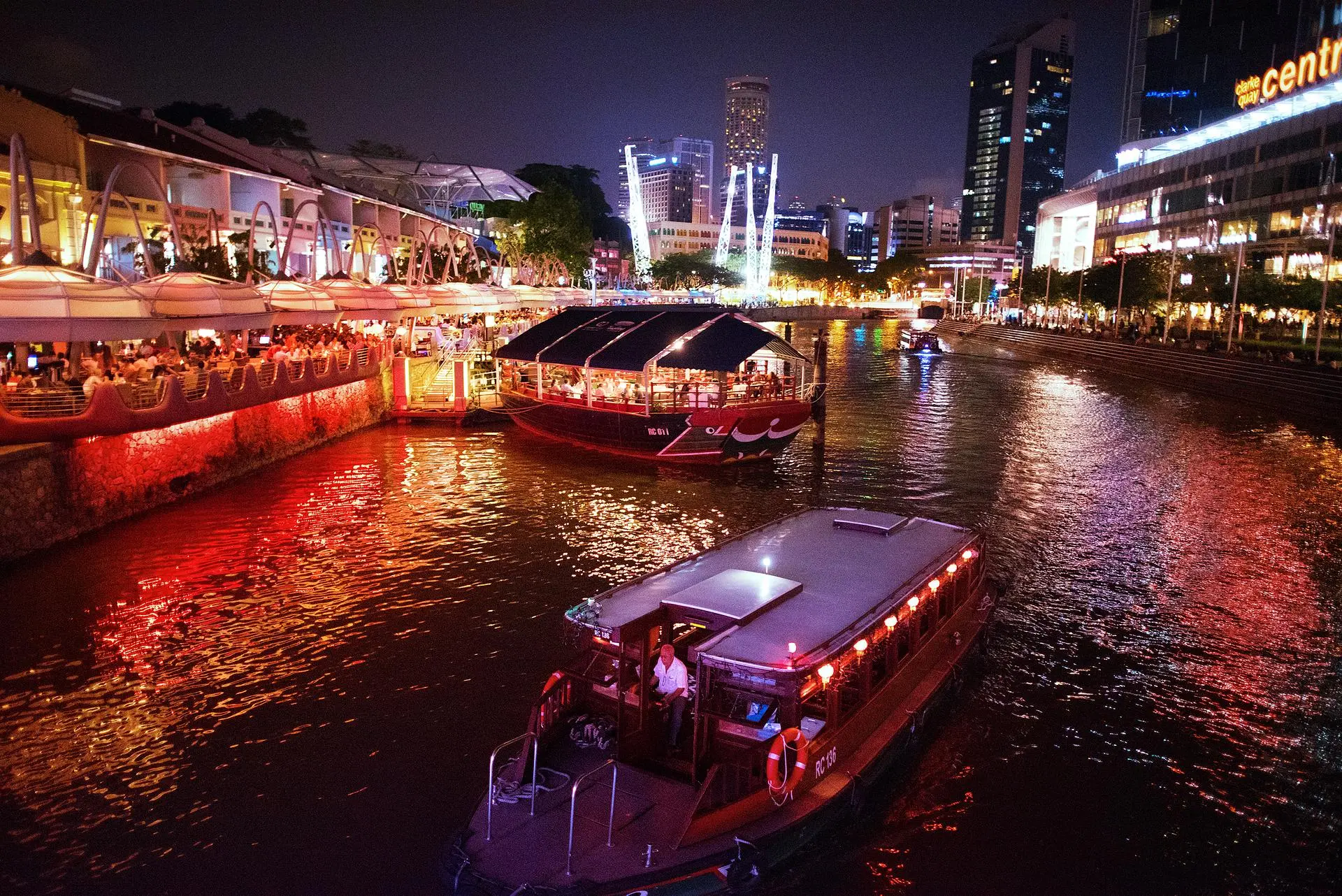 Clarke Quay and Singapore River waterfront on an evening river walk tour